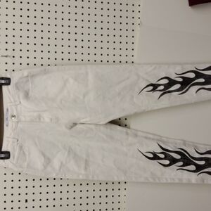 ADIKA jeans white with black flames accents lower legs.  NWOT size small